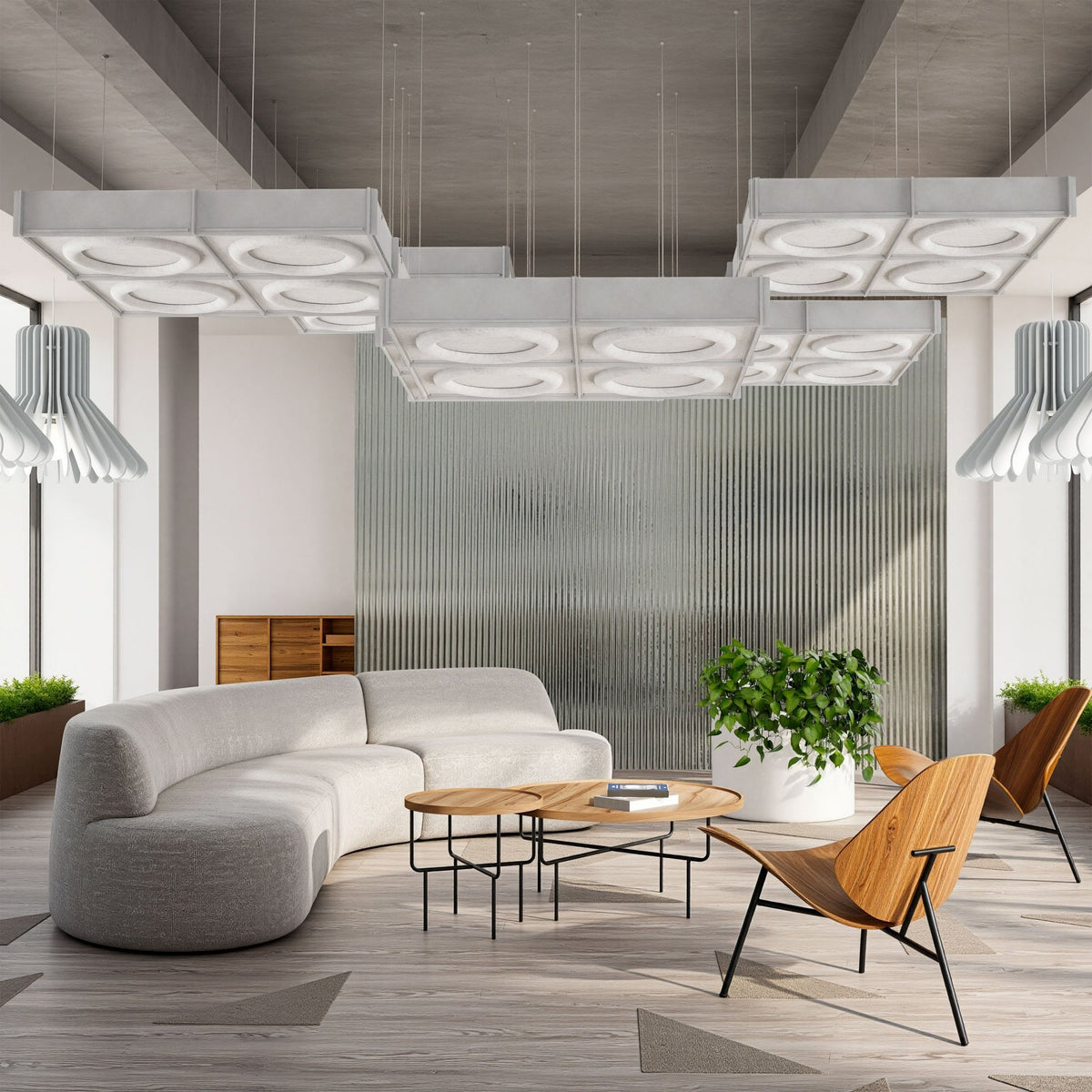 Halo Harmony3D BAFFL acoustic ceiling baffles with large circular ring panel reliefs.
