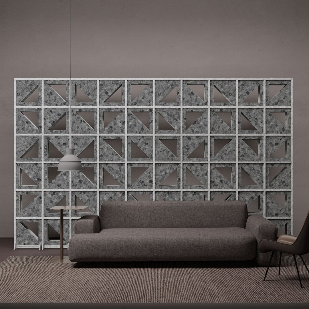 Hatch HarmonyBLOKS dark terrazzo acoustic divider in a modern lounge.