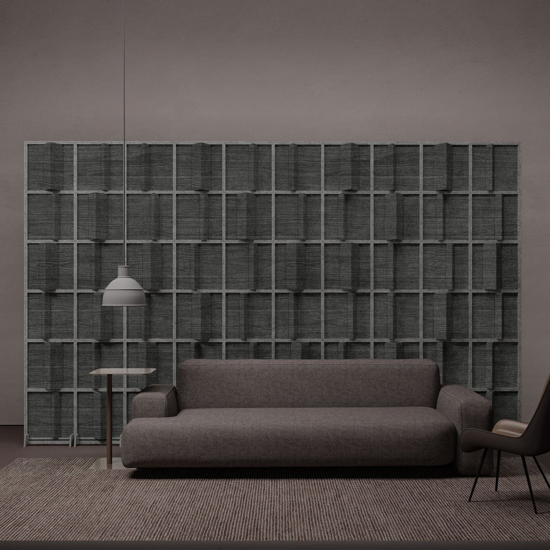 Pleat HarmonyBLOKS dark terrazzo room divider in a lounge.