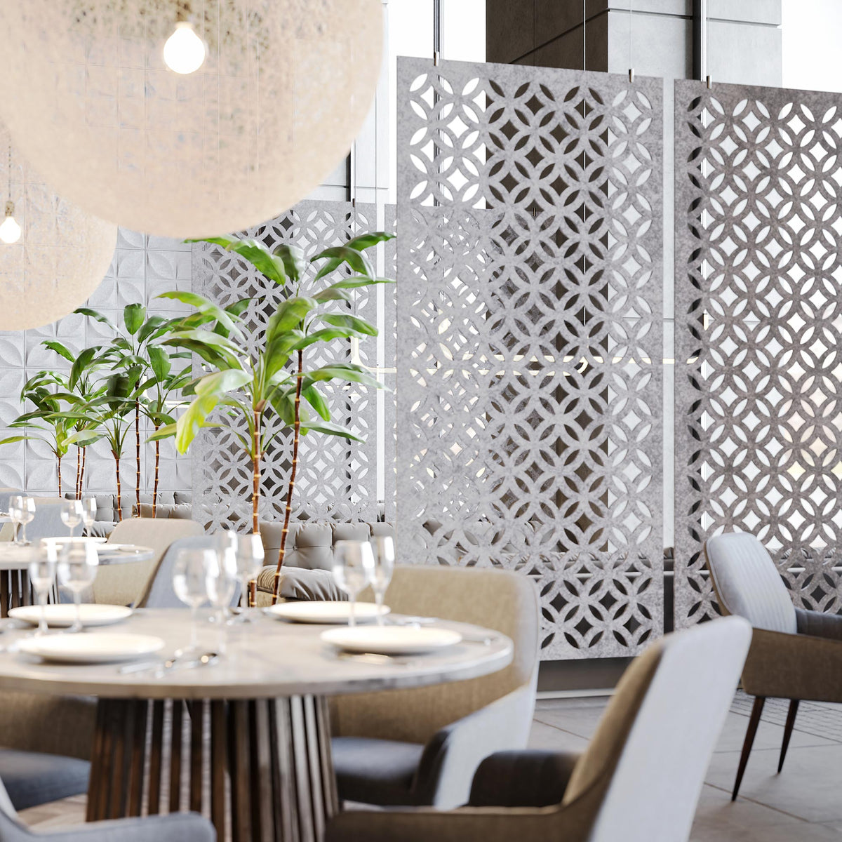 Light gray Chrysalis HarmonyDIVDR acoustic felt dividers defining seating in a commercial interior