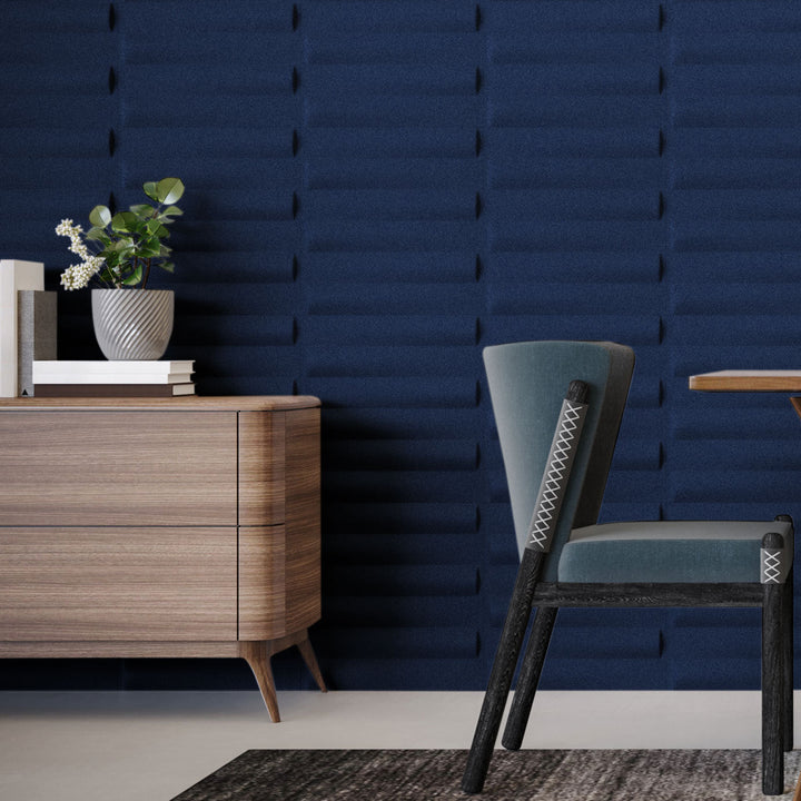 Navy Seesaw Harmony3D 3D acoustic wall panels behind a console and lounge chair